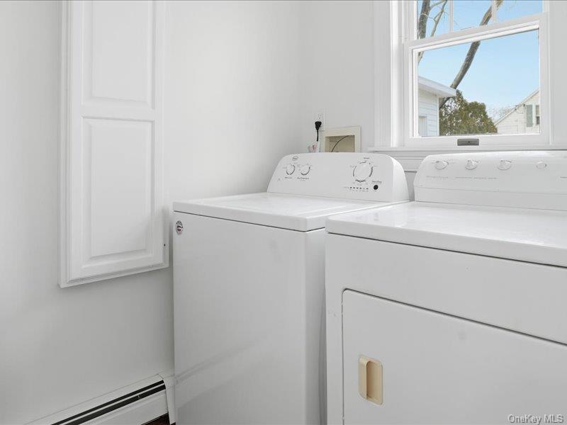 12 Summit Boulevard Westhampton, NY 11977 - Photo 15 of 17 a utility room with dryer and washer