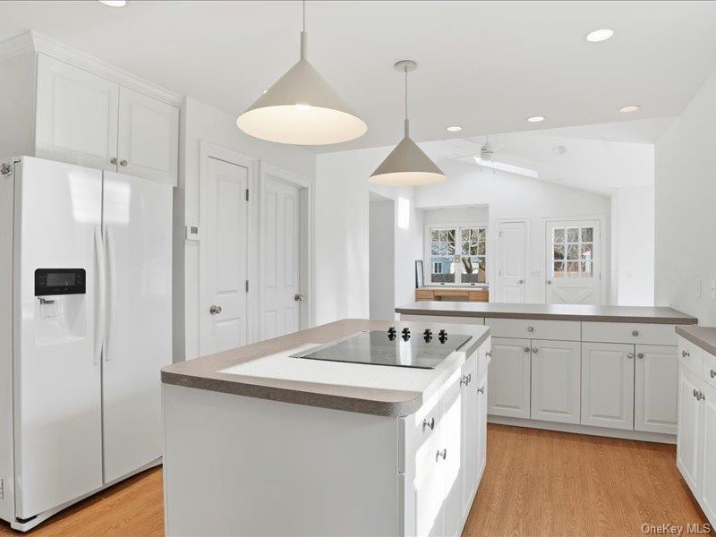 12 Summit Boulevard Westhampton, NY 11977 - Photo 5 of 17 a kitchen with a sink stove and refrigerator