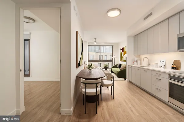 a kitchen with furniture wooden floor and dining table