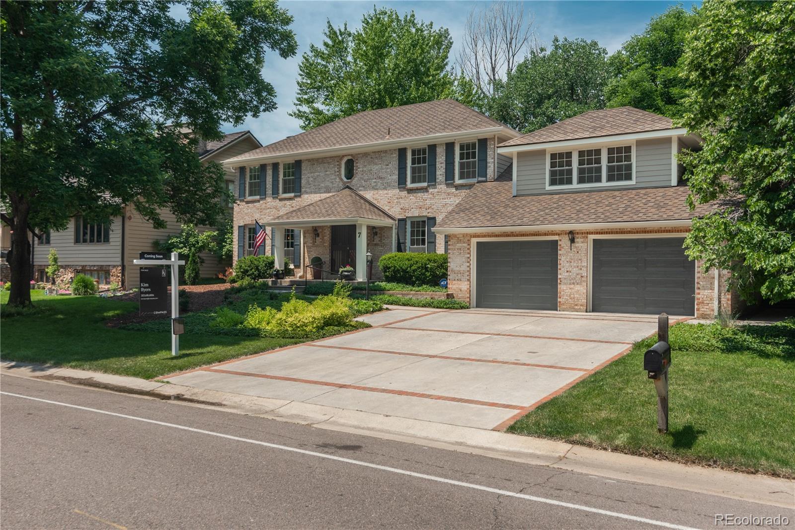 7 Middlefield Road Littleton, CO 80123 - Photo 1 of 39 a front view of a house with a yard and garage