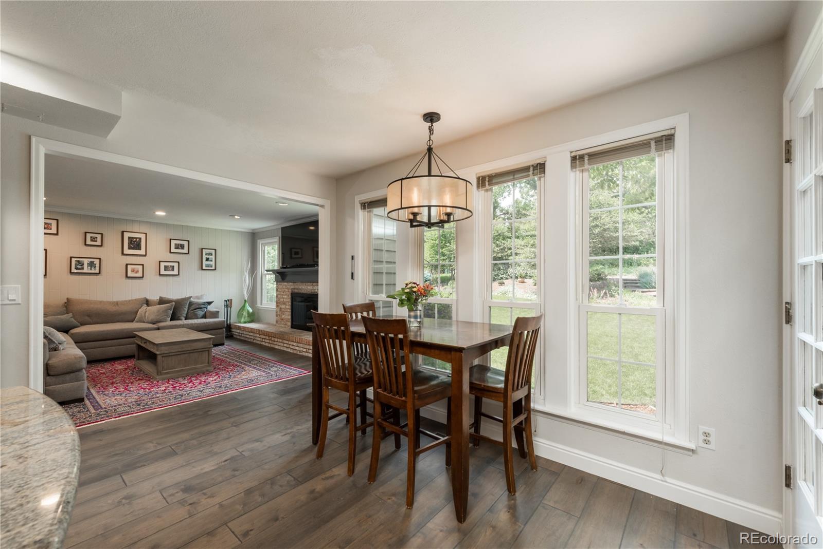 7 Middlefield Road Littleton, CO 80123 - Photo 13 of 39 a view of a dining room with furniture window and wooden floor