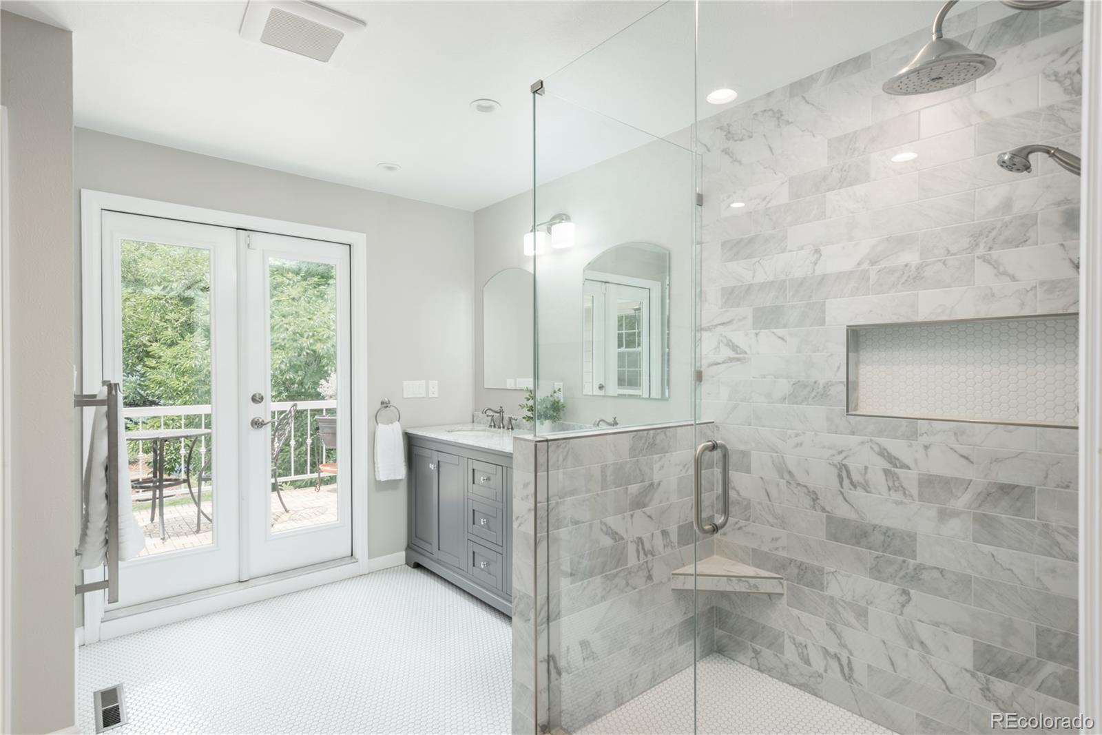 7 Middlefield Road Littleton, CO 80123 - Photo 15 of 39 a bathroom with double vanity and a shower