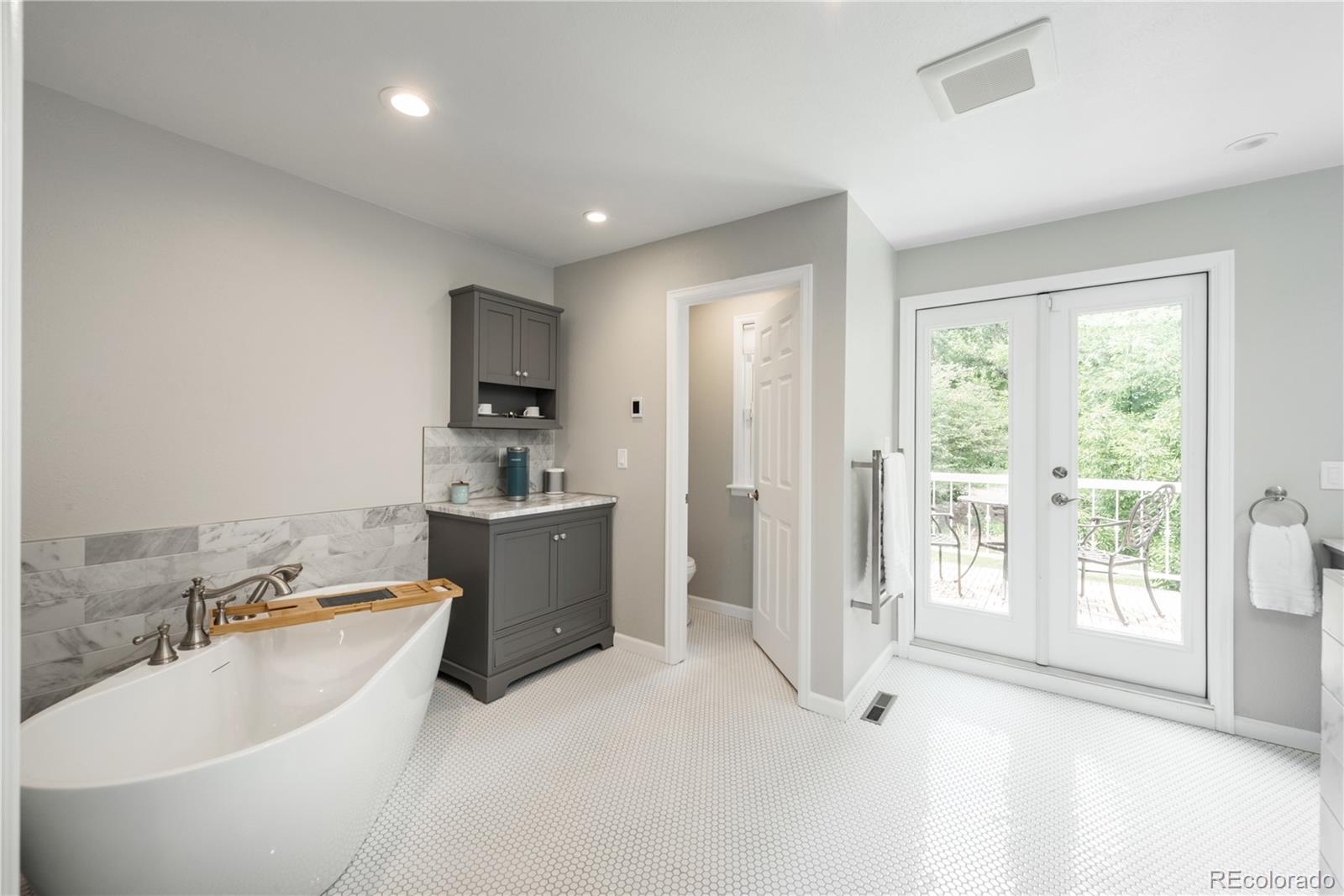 7 Middlefield Road Littleton, CO 80123 - Photo 16 of 39 a bathroom with a bathtub sink and toilet