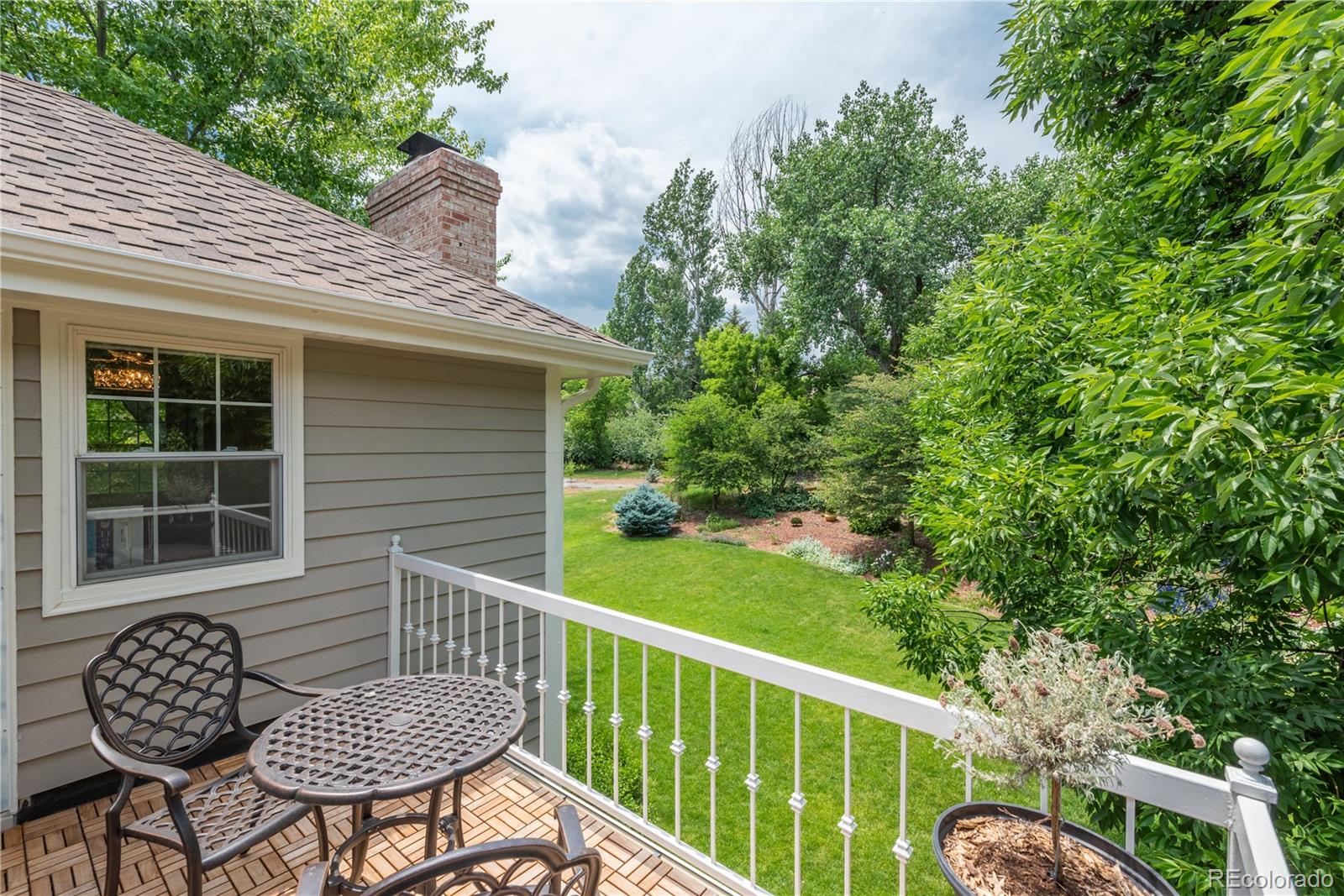 7 Middlefield Road Littleton, CO 80123 - Photo 19 of 39 a view of a chair and table in backyard of the house