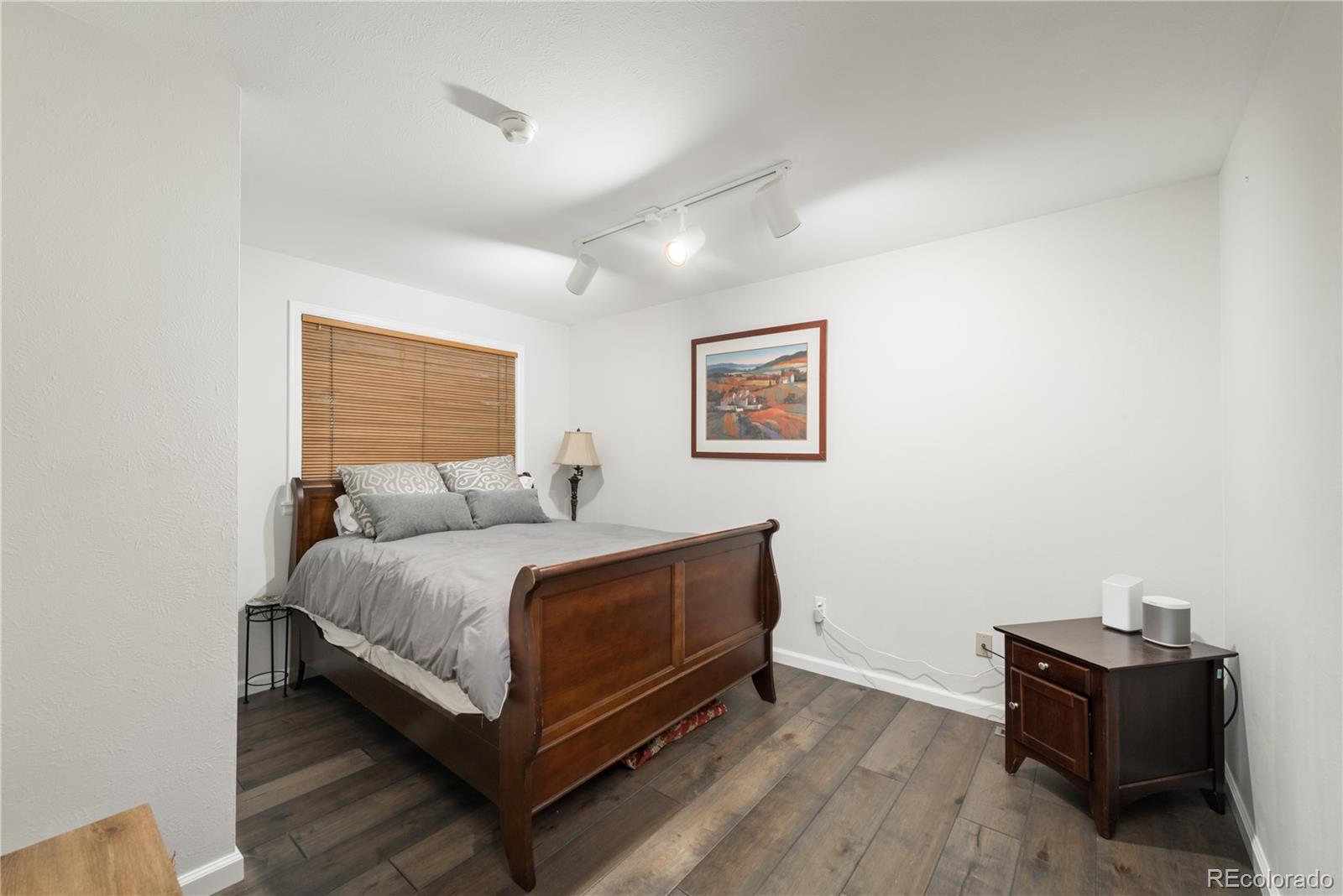 7 Middlefield Road Littleton, CO 80123 - Photo 25 of 39 a bedroom with a bed and dresser