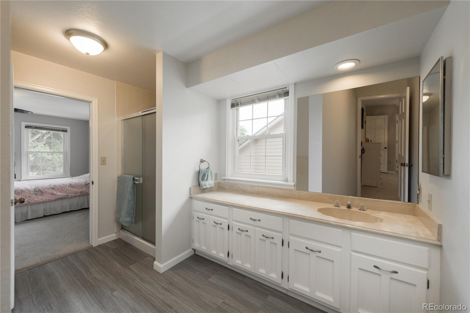 7 Middlefield Road Littleton, CO 80123 - Photo 28 of 39 a spacious bathroom with double sink large mirror and next to a window