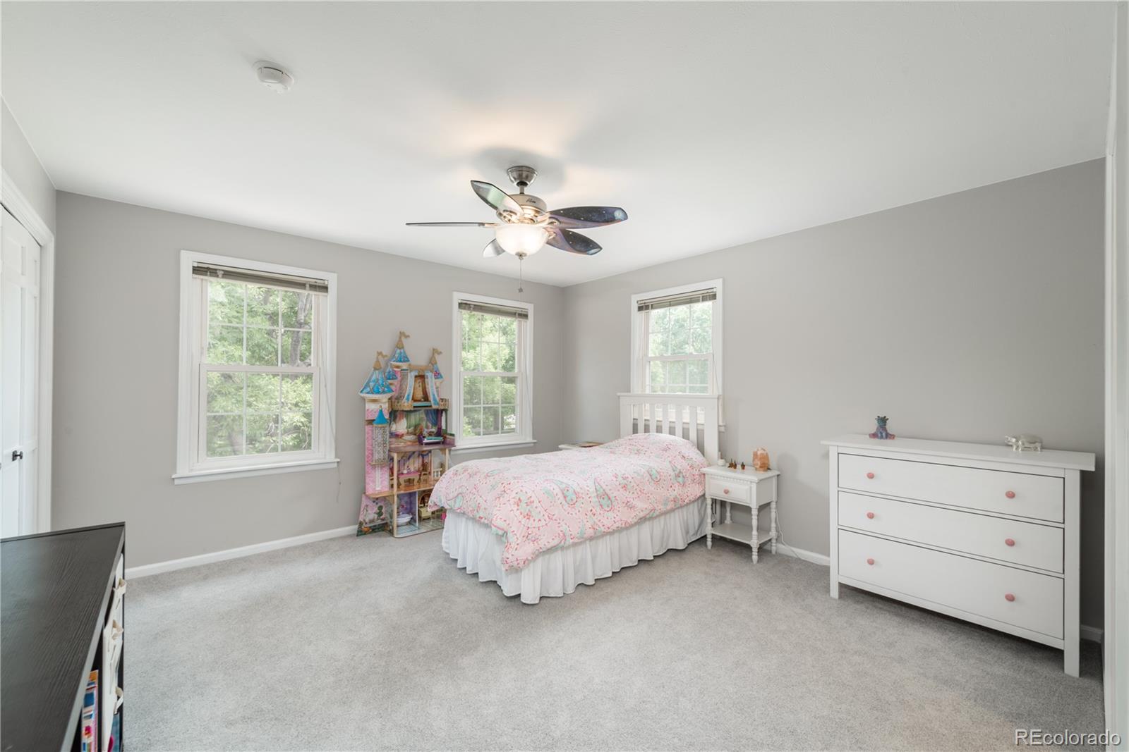 7 Middlefield Road Littleton, CO 80123 - Photo 29 of 39 a spacious bedroom with a bed and window