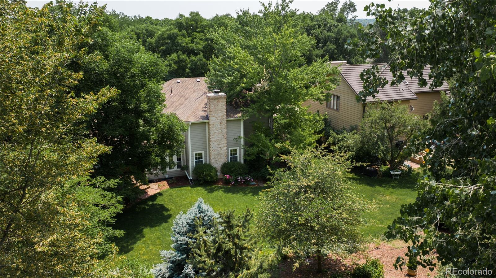 7 Middlefield Road Littleton, CO 80123 - Photo 36 of 39 a view of a house with a yard and tree s