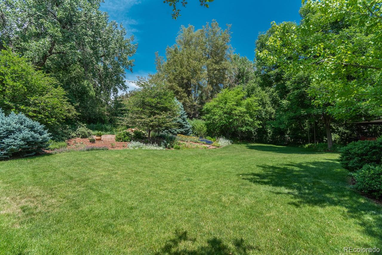 7 Middlefield Road Littleton, CO 80123 - Photo 38 of 39 a view of a green field with lots of bushes