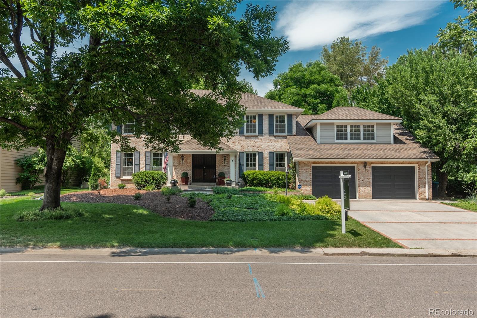 7 Middlefield Road Littleton, CO 80123 - Photo 39 of 39 a front view of a house with a garden