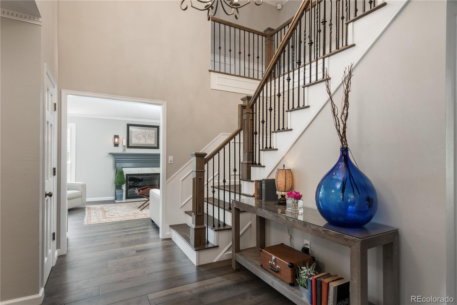 7 Middlefield Road Littleton, CO 80123 - Photo 4 of 39 a view of entryway and hall with wooden floor