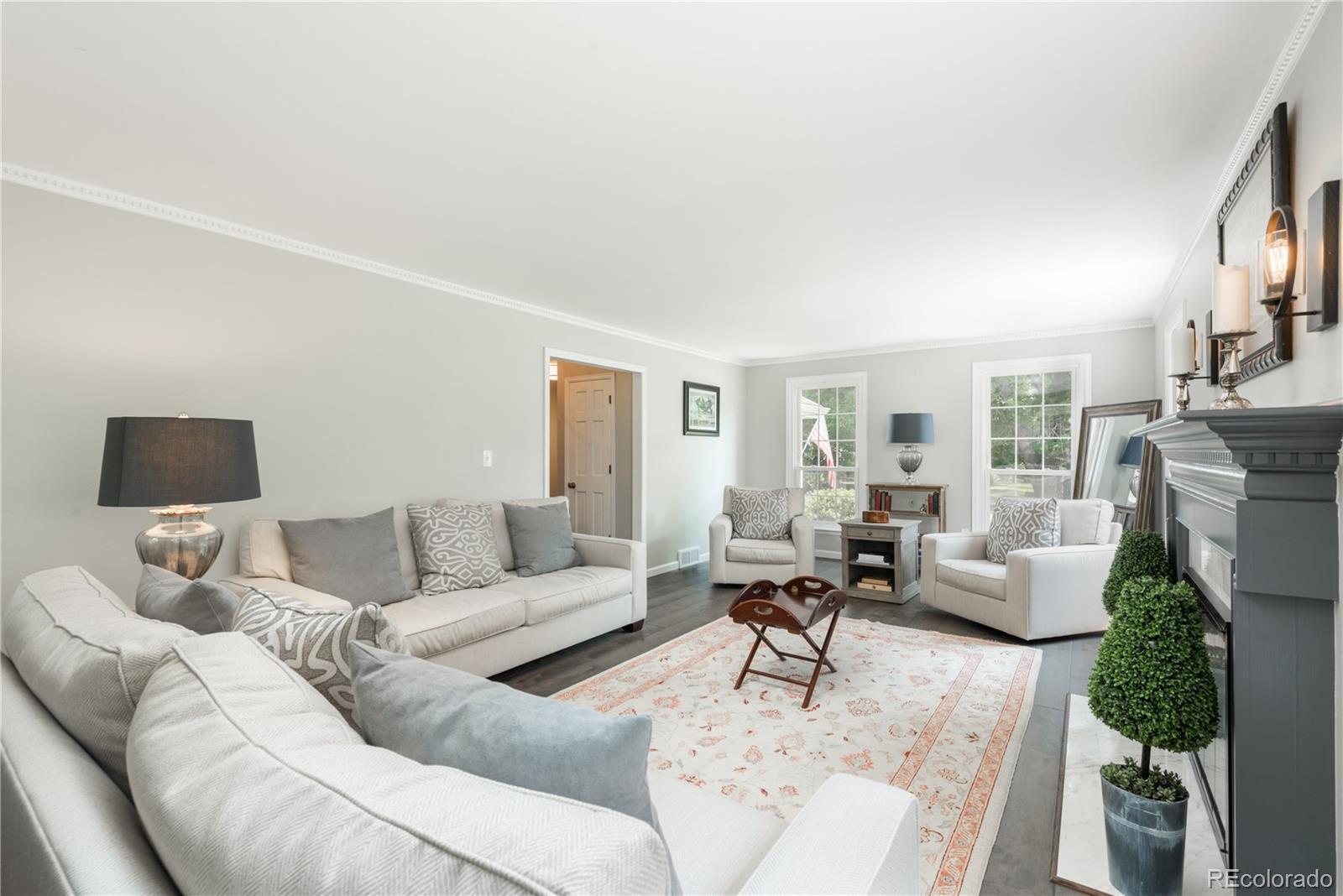 7 Middlefield Road Littleton, CO 80123 - Photo 6 of 39 a living room with furniture and a flat screen tv