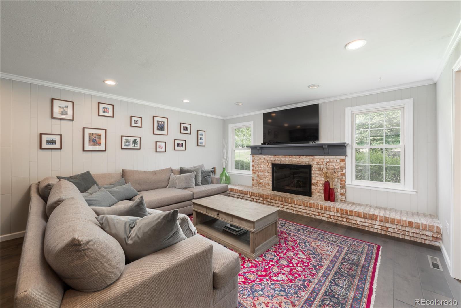 7 Middlefield Road Littleton, CO 80123 - Photo 7 of 39 a living room with furniture or couch and a flat screen tv