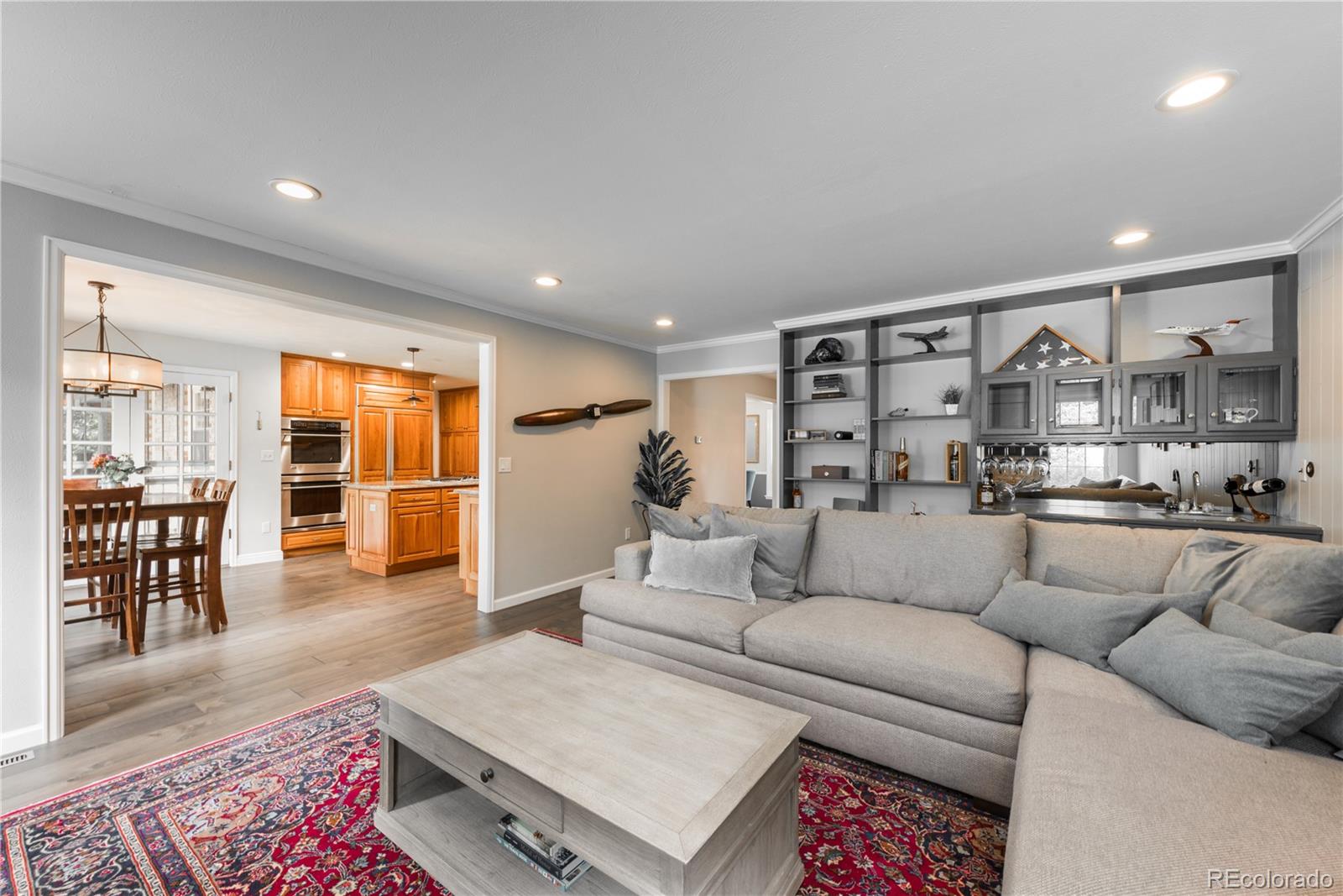 7 Middlefield Road Littleton, CO 80123 - Photo 8 of 39 a living room with furniture and kitchen view