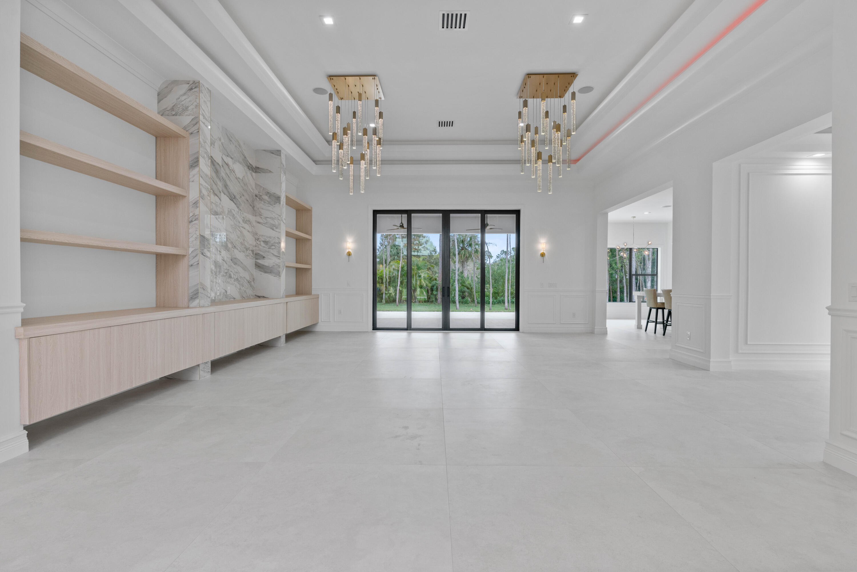 17794 Mellen Lane Jupiter, FL 33478 - Photo 11 of 45 wooden floor in an empty room with a window