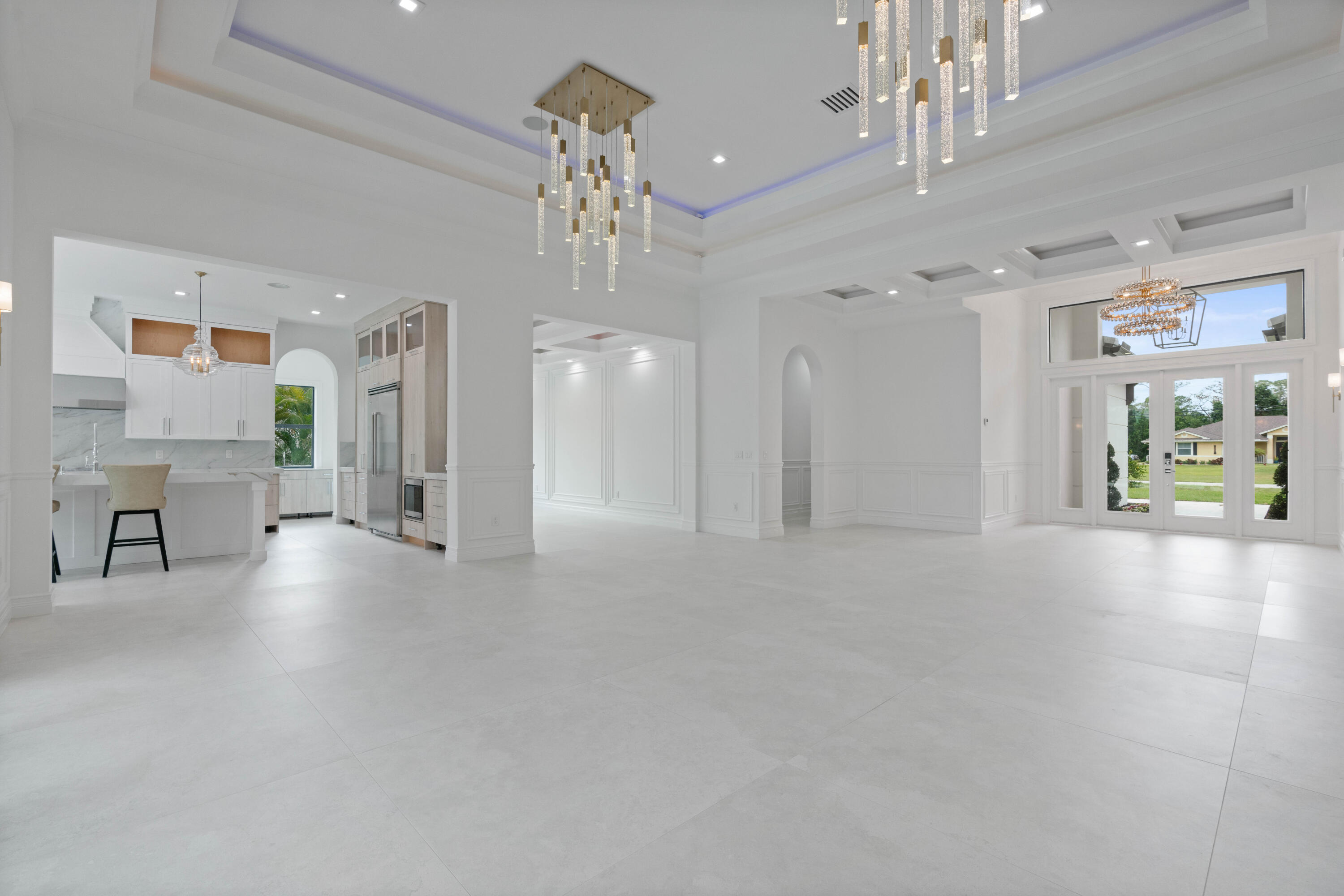 17794 Mellen Lane Jupiter, FL 33478 - Photo 12 of 45 a view of a chandelier and a livingroom with furniture chandelier livingroom and chandelier