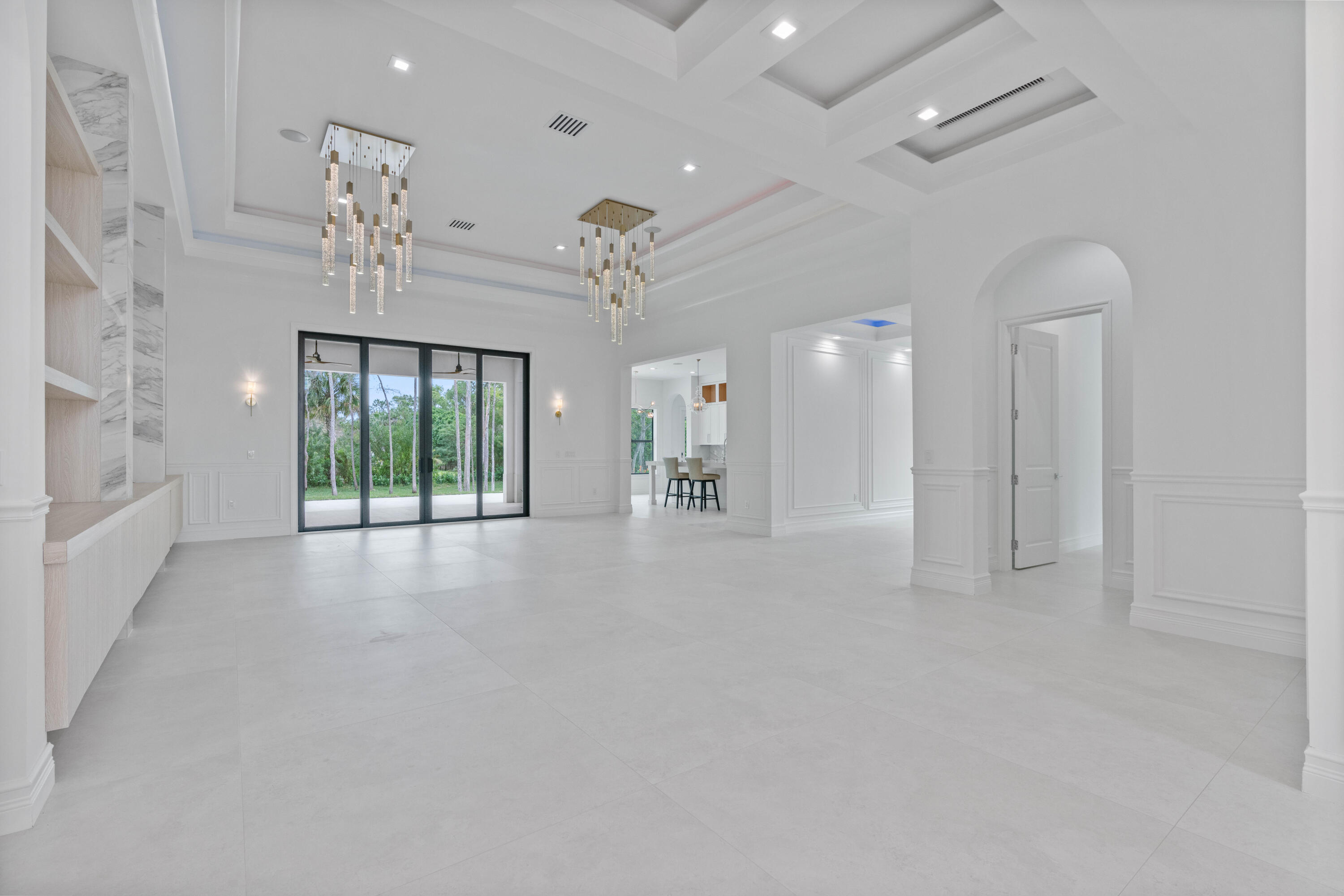 17794 Mellen Lane Jupiter, FL 33478 - Photo 13 of 45 an entryway with a ceiling fan and windows