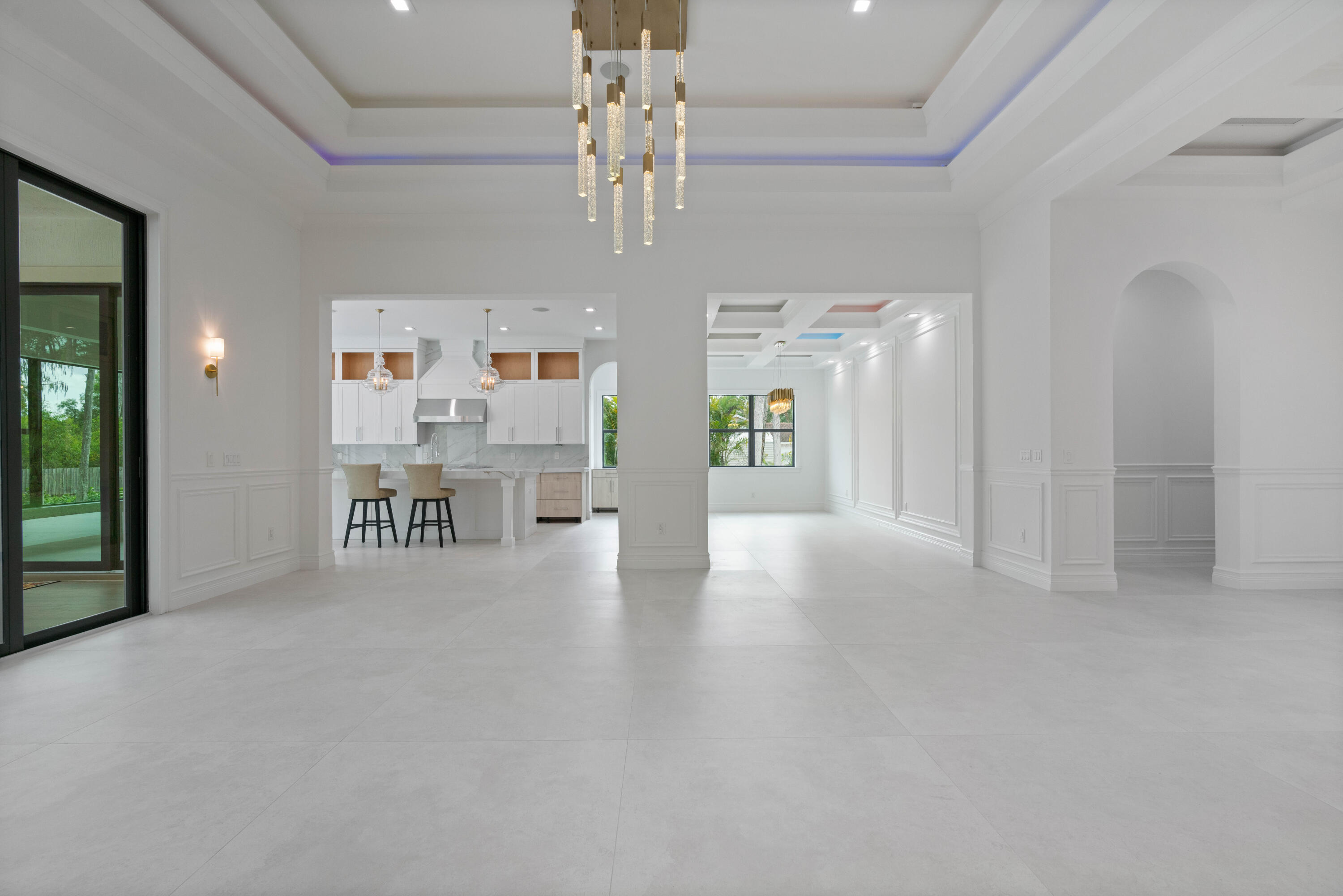 17794 Mellen Lane Jupiter, FL 33478 - Photo 15 of 45 a view of an empty room and a chandelier