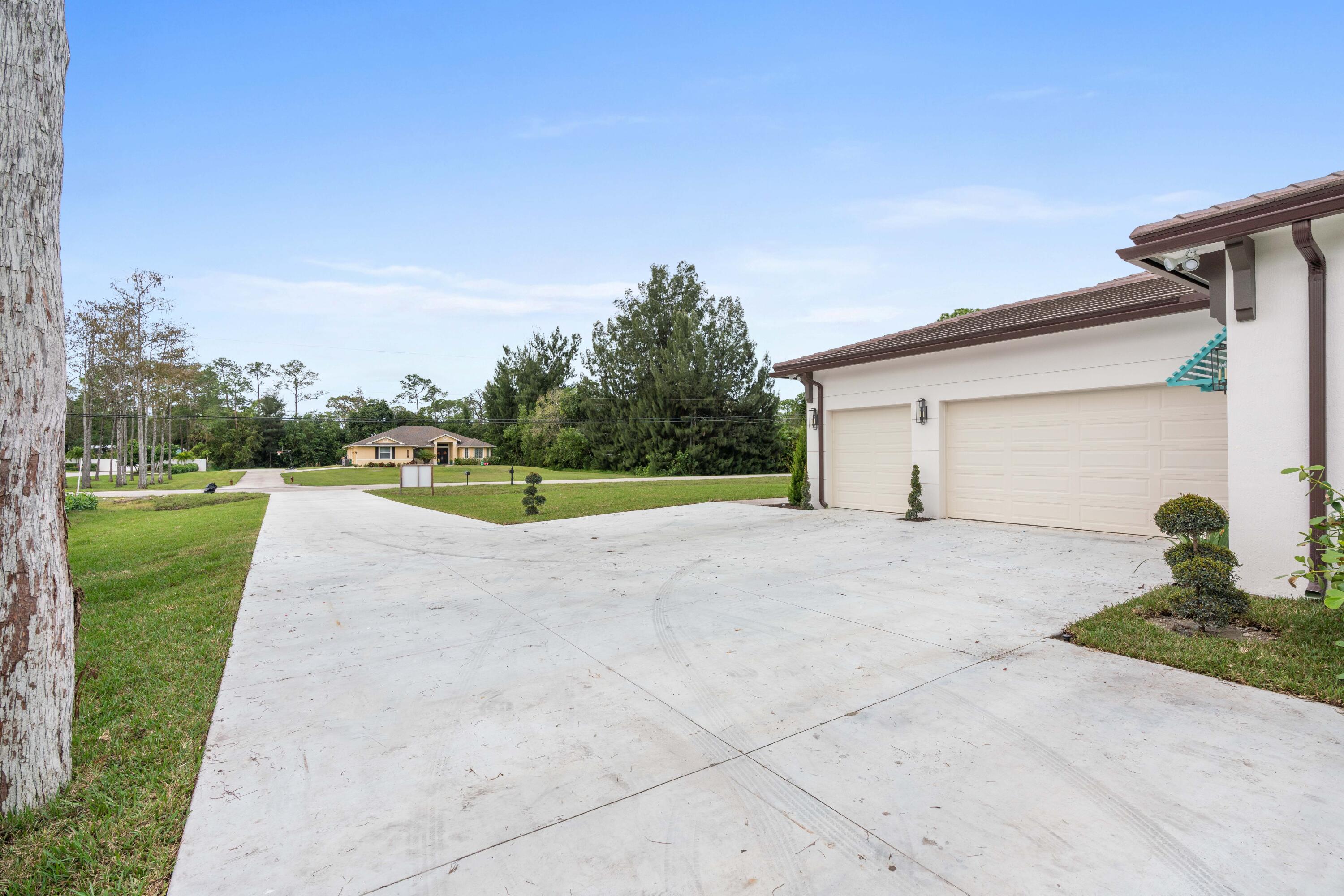 17794 Mellen Lane Jupiter, FL 33478 - Photo 24 of 45 a view of a house with backyard