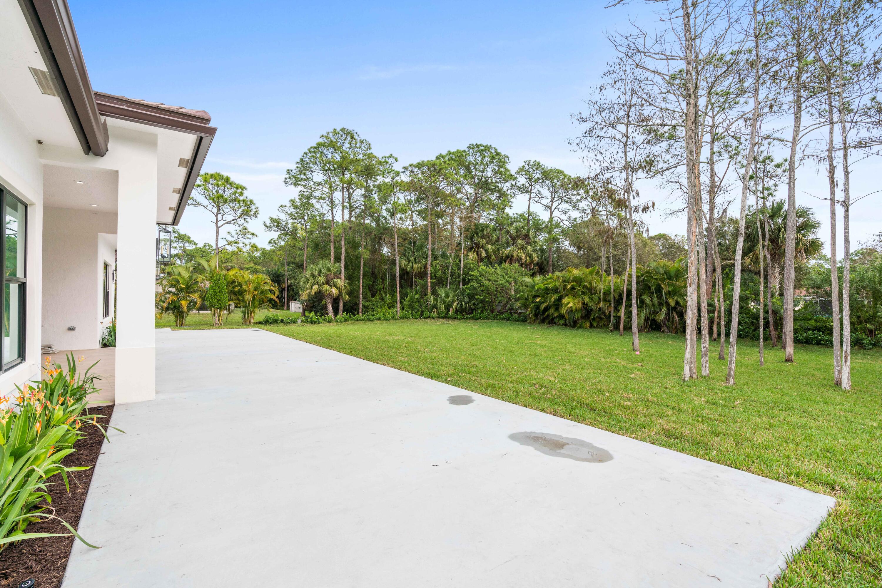 17794 Mellen Lane Jupiter, FL 33478 - Photo 28 of 45 a view of a house with a yard