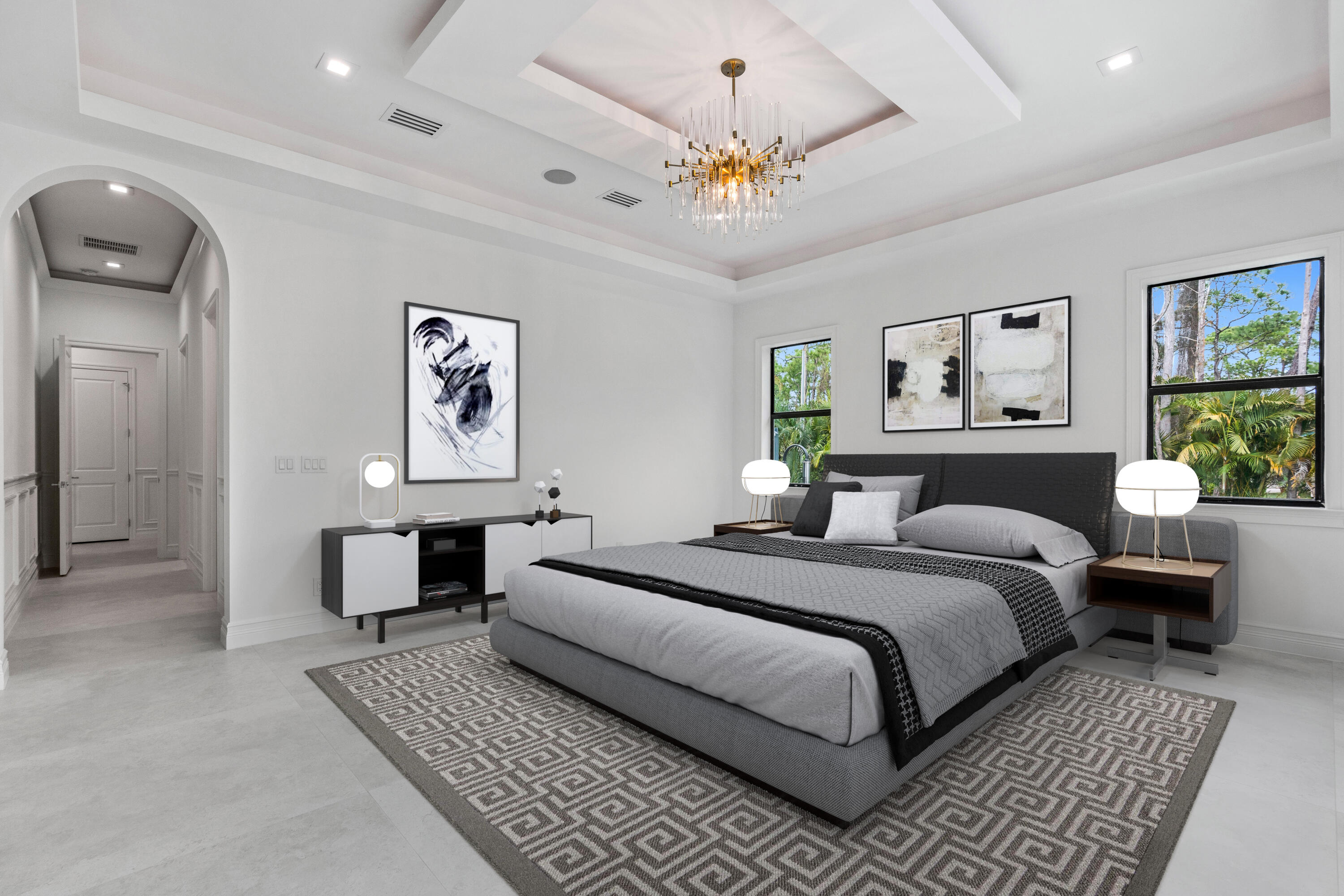 17794 Mellen Lane Jupiter, FL 33478 - Photo 29 of 45 a bedroom with a large bed and a chandelier