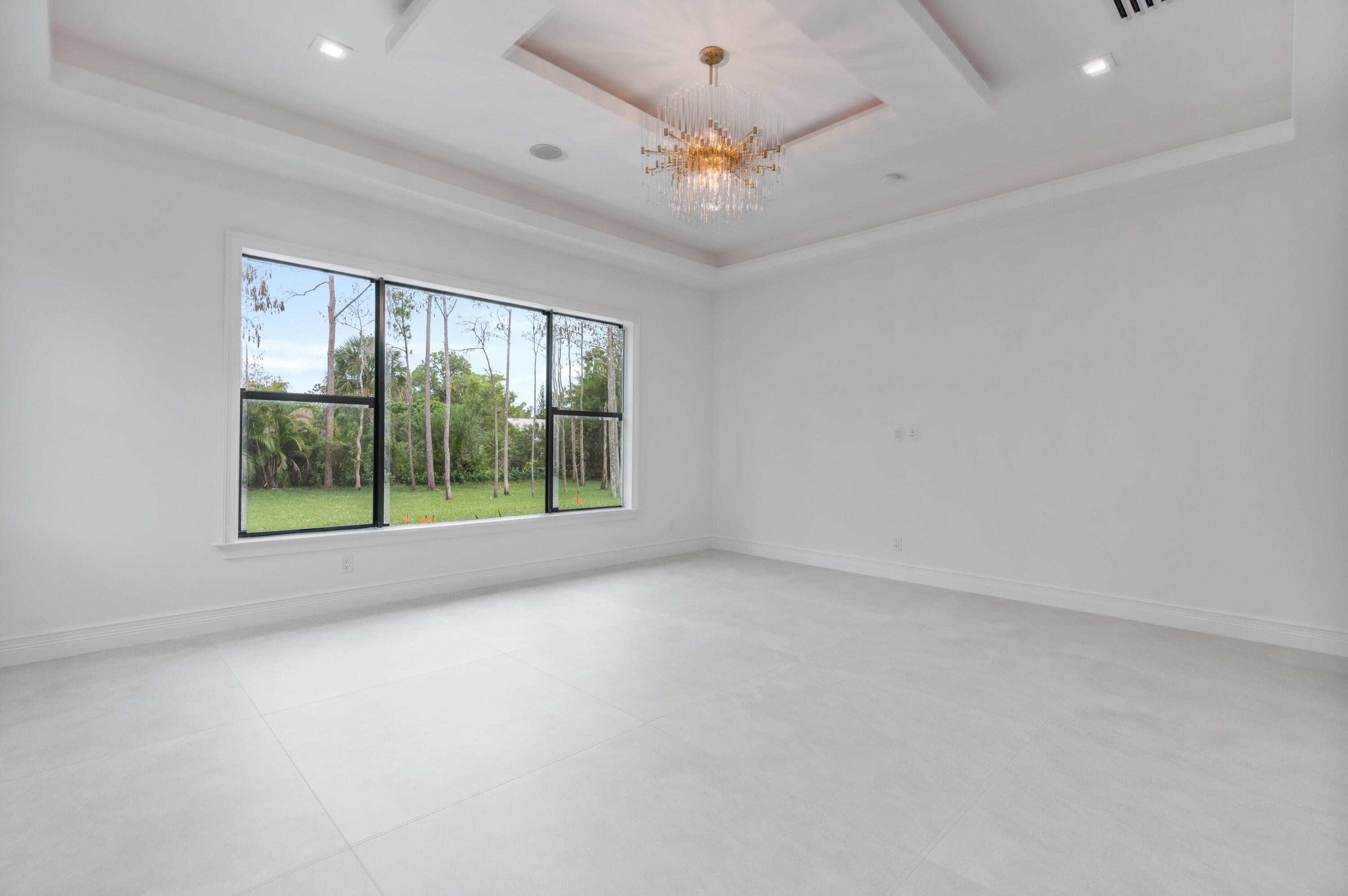 17794 Mellen Lane Jupiter, FL 33478 - Photo 31 of 45 wooden floor in an empty room with a window
