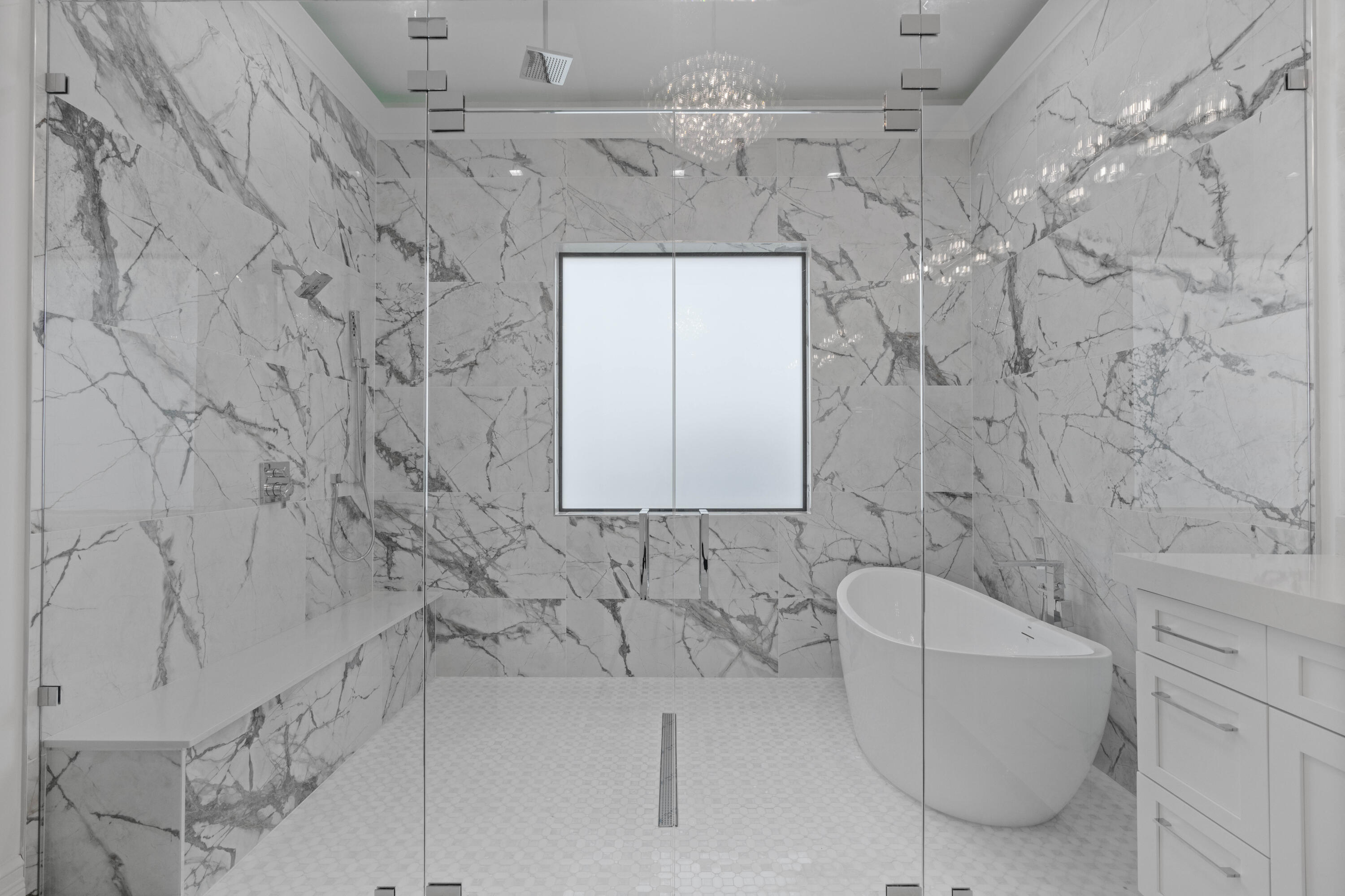 17794 Mellen Lane Jupiter, FL 33478 - Photo 34 of 45 a bathroom with a bathtub and shower