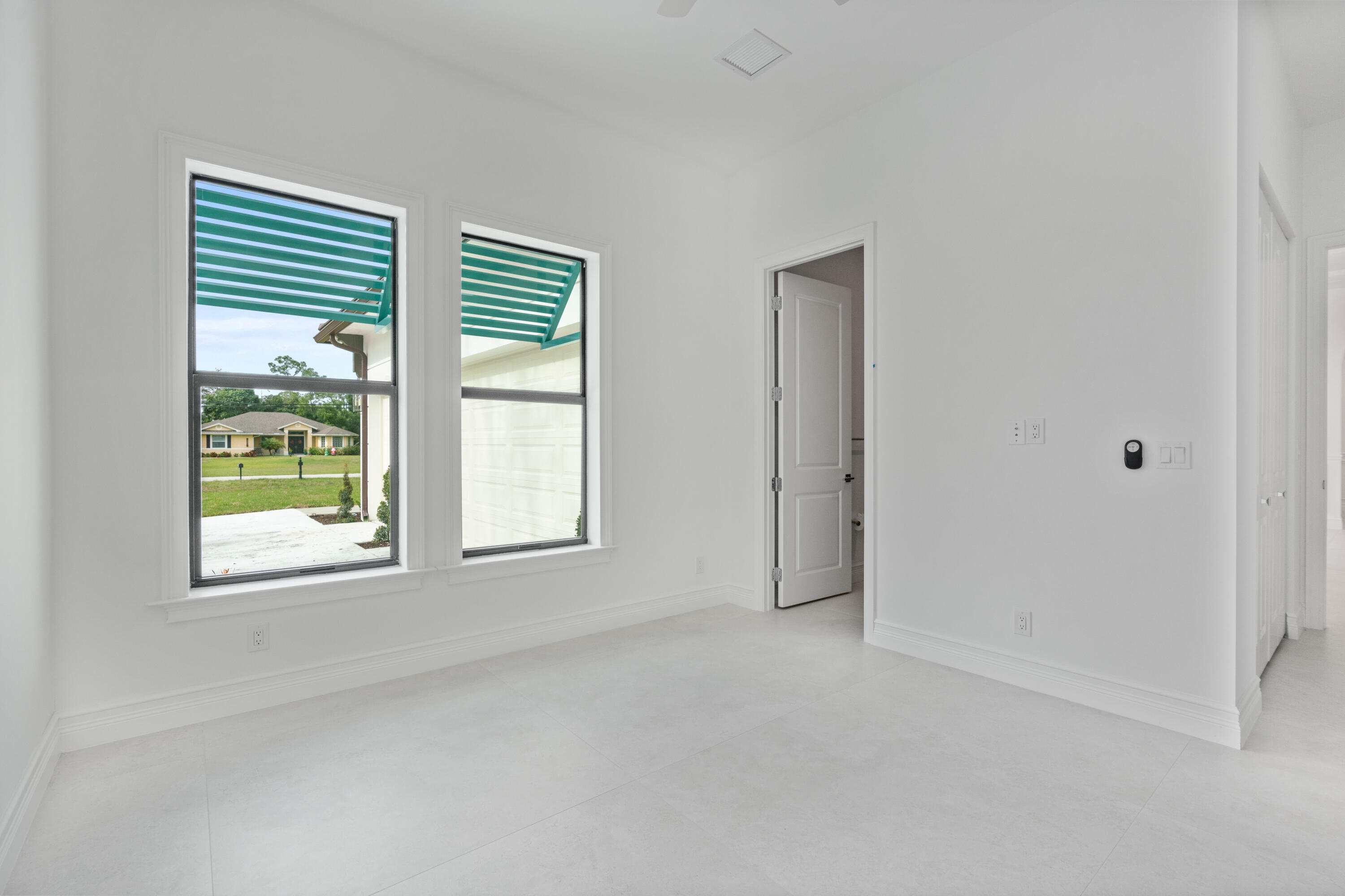 17794 Mellen Lane Jupiter, FL 33478 - Photo 37 of 45 an empty room with windows