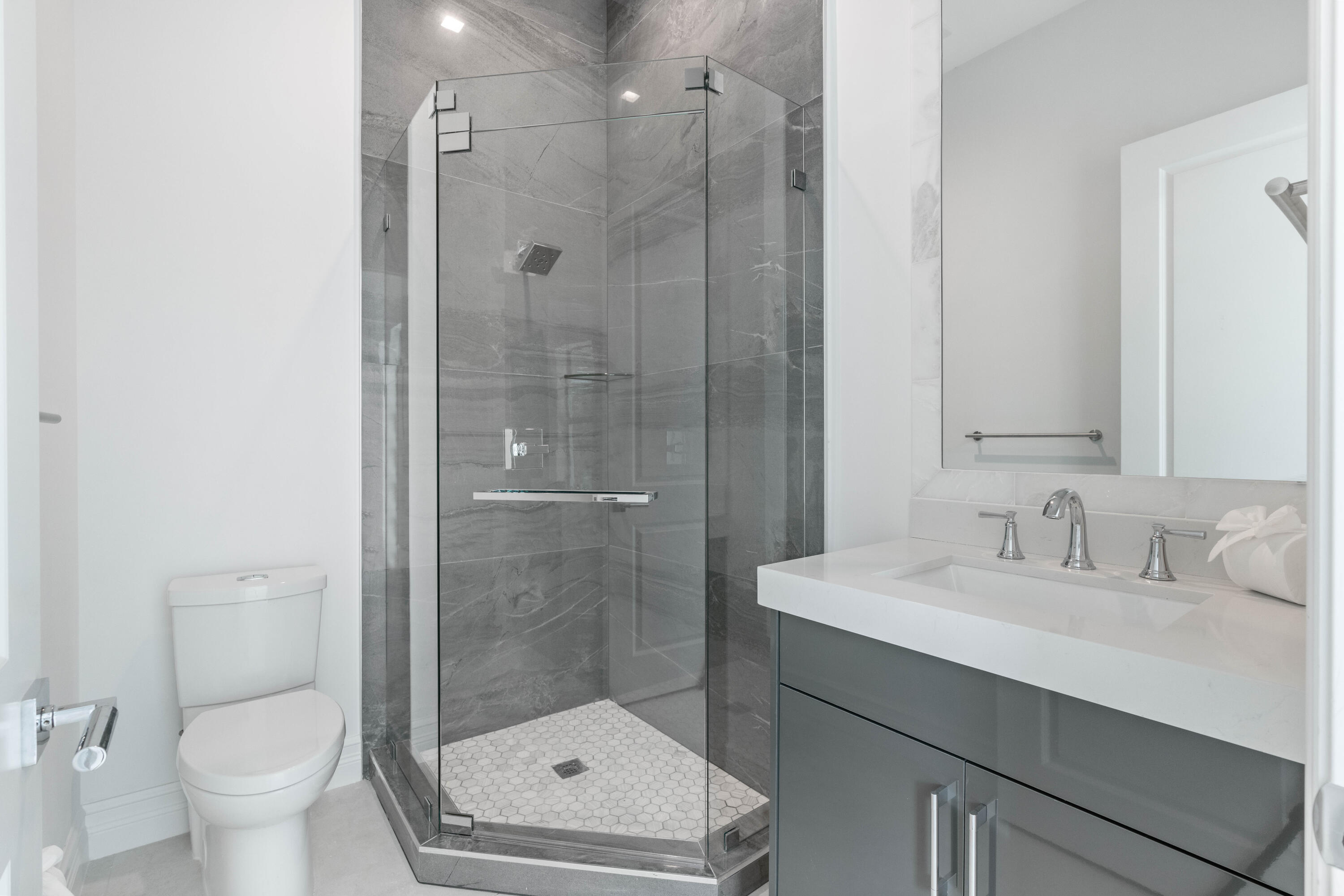 17794 Mellen Lane Jupiter, FL 33478 - Photo 39 of 45 a bathroom with a sink toilet and shower