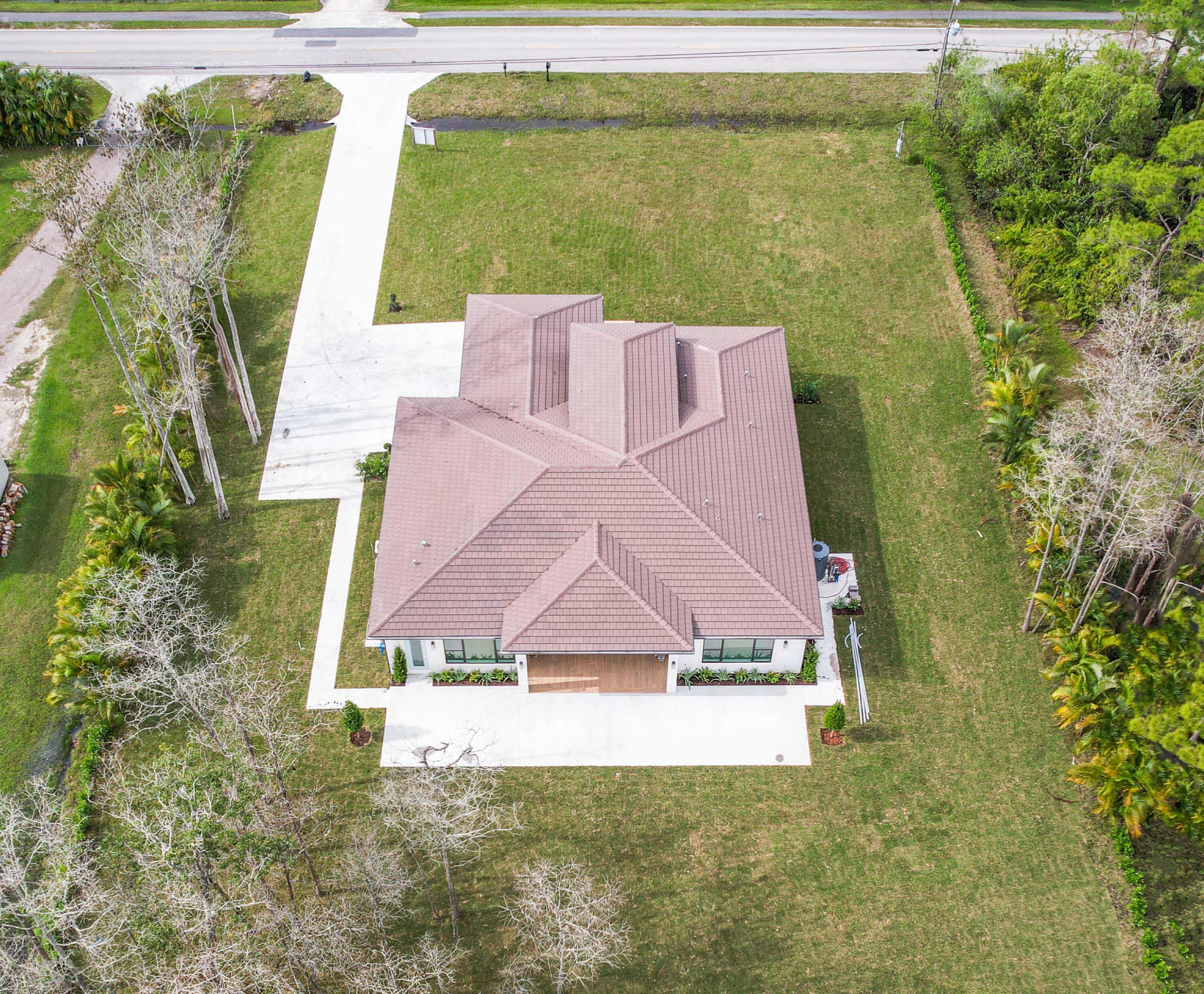 17794 Mellen Lane Jupiter, FL 33478 - Photo 43 of 45 a view of a yard in front of the house