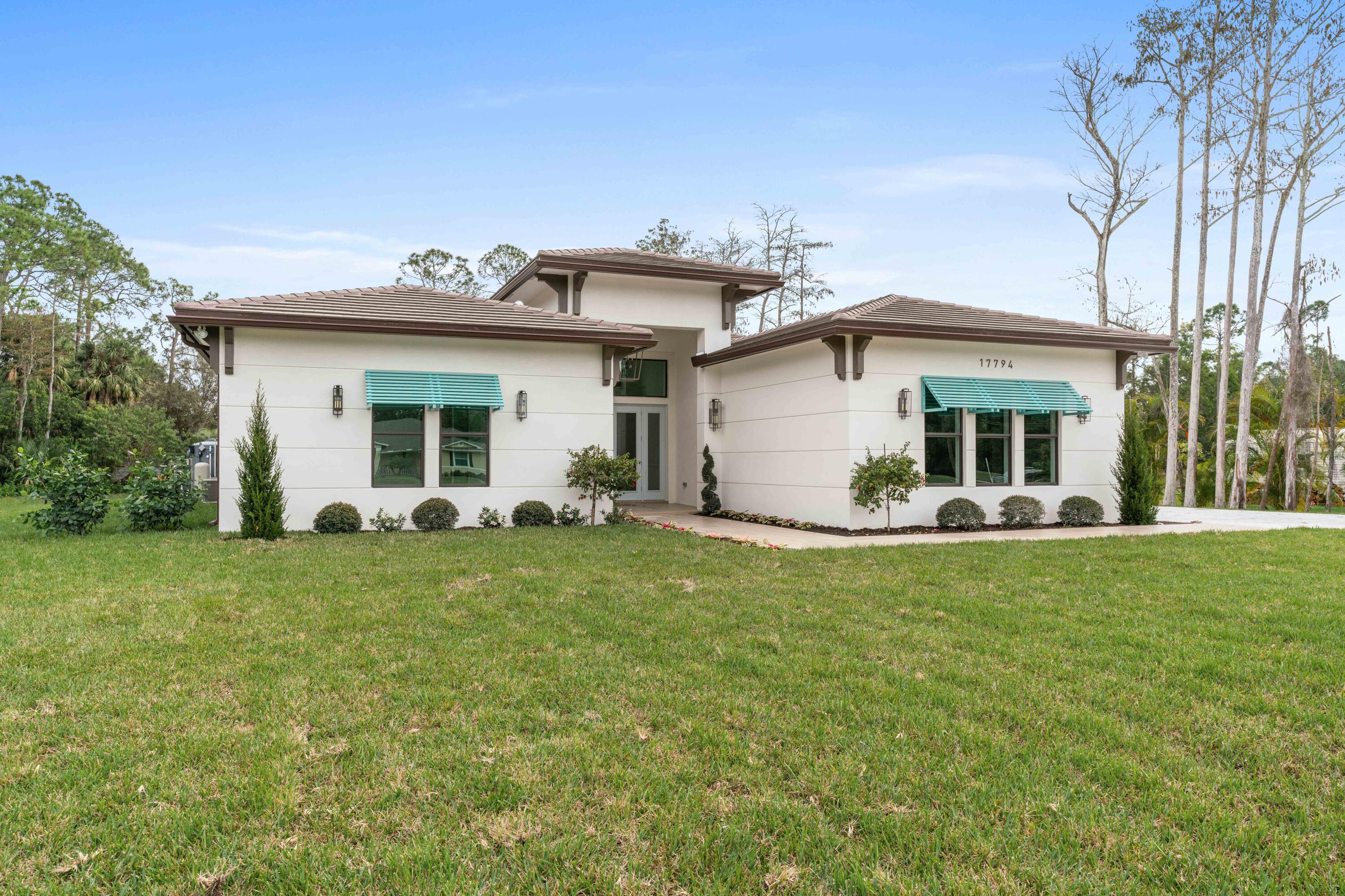17794 Mellen Lane Jupiter, FL 33478 - Photo 7 of 45 a view of a house with a backyard
