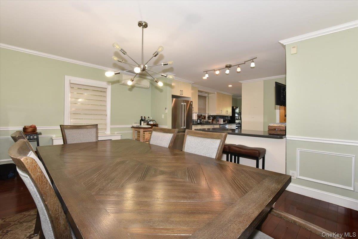 193-46 McLaughlin Avenue Queens, NY 11423 - Photo 14 of 34 a view of kitchen with dining table and chairs