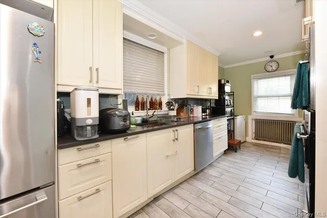a kitchen with granite countertop white cabinets and white appliances