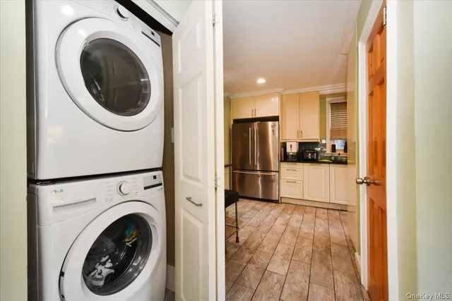 a view of a kitchen with a washer and dryer