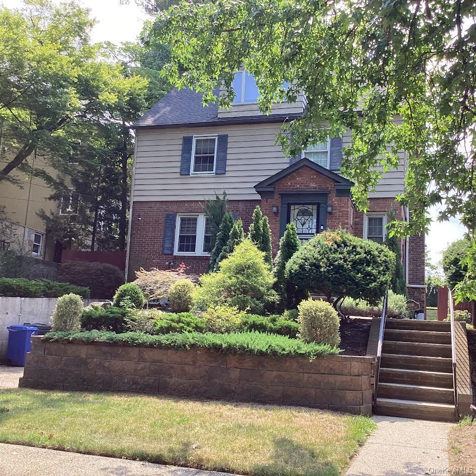 193-46 McLaughlin Avenue Queens, NY 11423 - Photo 2 of 34 a front view of a house with a yard