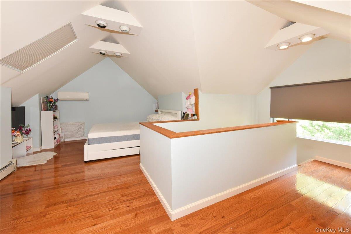 193-46 McLaughlin Avenue Queens, NY 11423 - Photo 25 of 34 a living room with furniture and a wooden floor