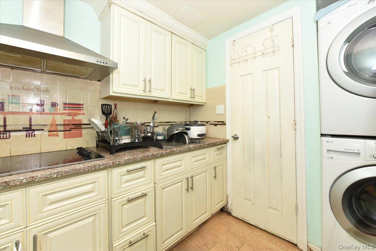 193-46 McLaughlin Avenue Queens, NY 11423 - Photo 29 of 34 a kitchen with granite countertop white cabinets and a sink