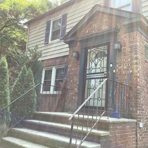 a view of a balcony with a potted plant
