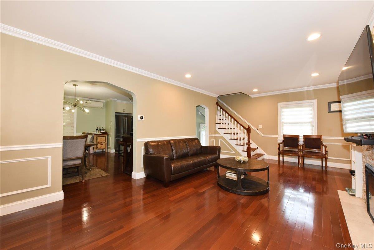 193-46 McLaughlin Avenue Queens, NY 11423 - Photo 10 of 34 a living room with furniture and a wooden floor
