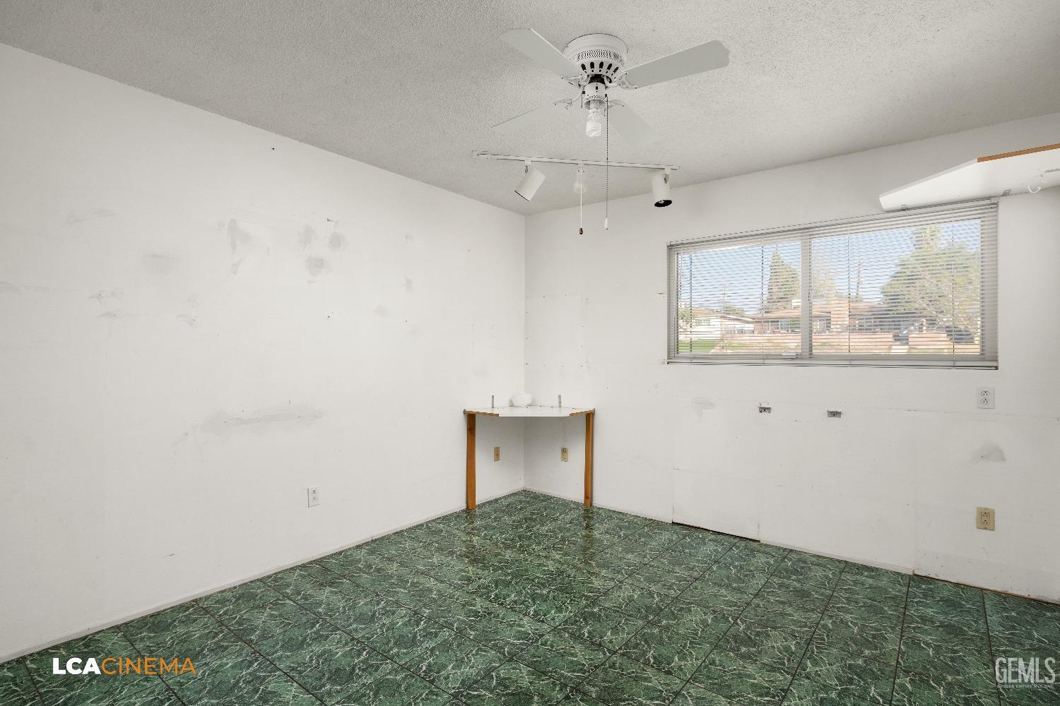 Undisclosed Address Bakersfield, CA 93306 - Photo 13 of 20 a view of an empty room with a window
