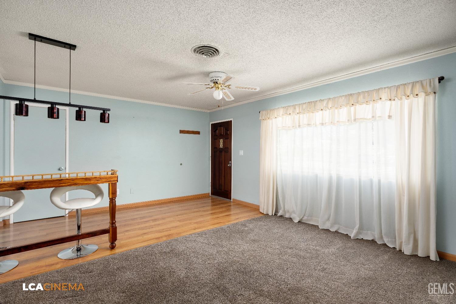 Undisclosed Address Bakersfield, CA 93306 - Photo 6 of 20 a view of an empty room with windows & cabinet