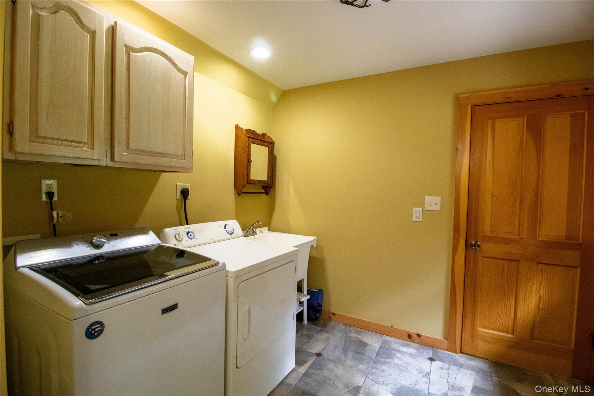 384 Morton Hill Road Roscoe, NY 12776 - Photo 23 of 27 Washroom with washer and clothes dryer, cabinet space, and recessed lighting
