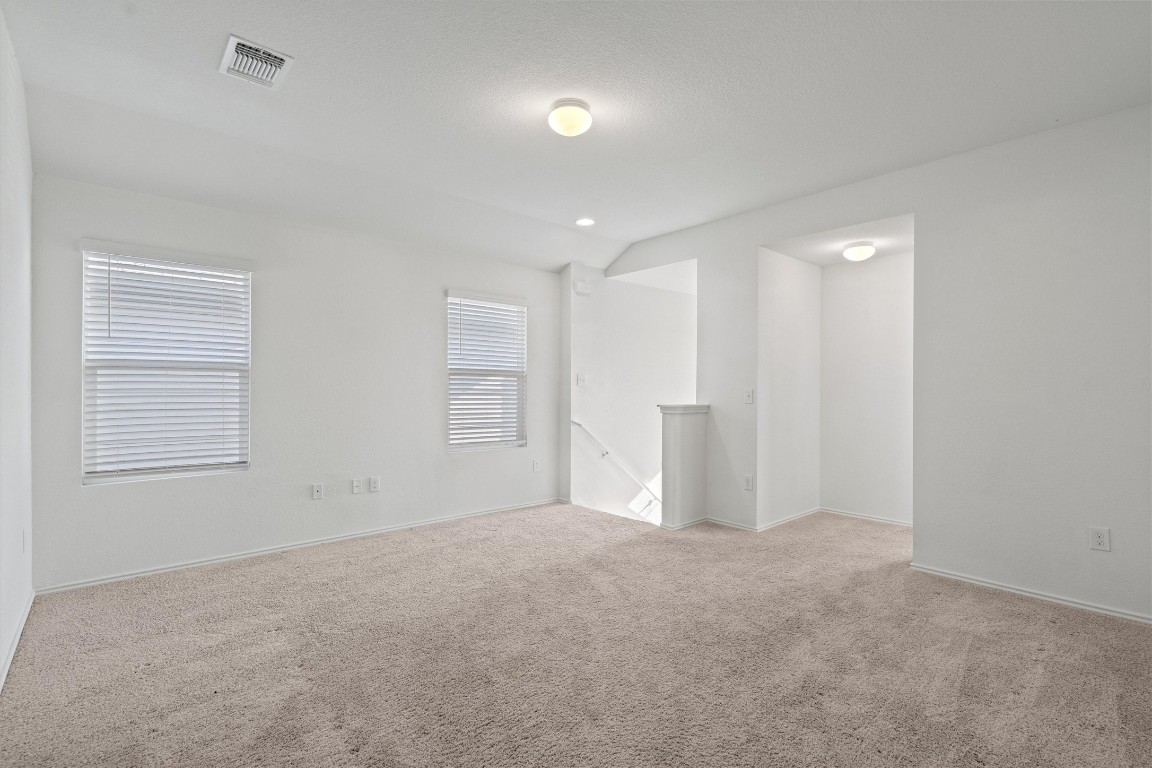 11908 Pyrite Road Manor, TX 78653 - Photo 18 of 35 a view of an empty room with a window