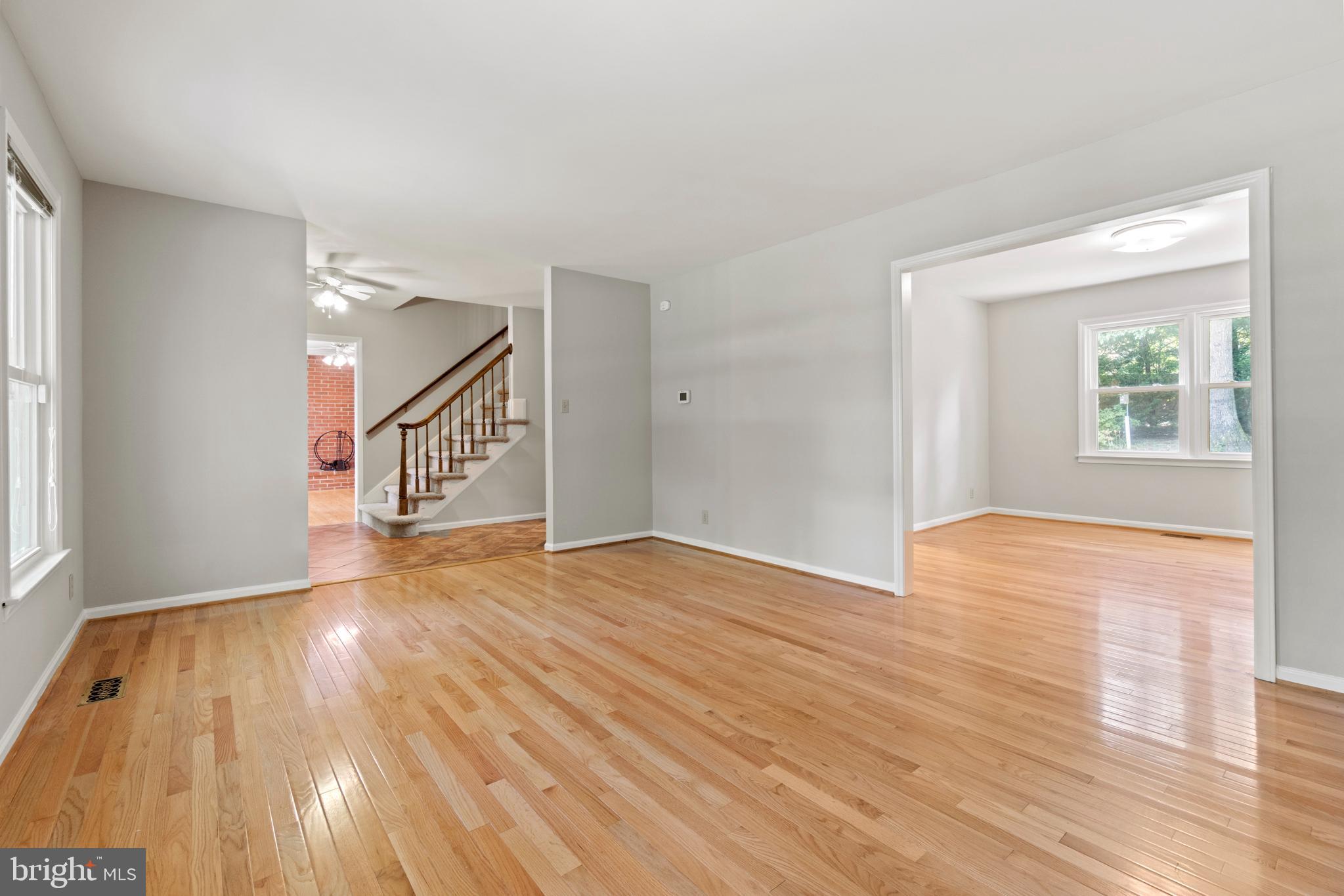 15 Rolling Road Stafford, VA 22556 - Photo 8 of 22 a view of an empty room and wooden floor and windows