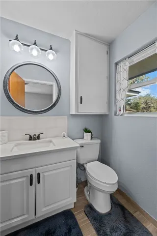 a bathroom with a sink a mirror and a shower