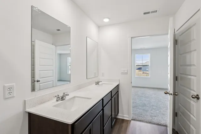 a bathroom with a sink toilet tub and shower