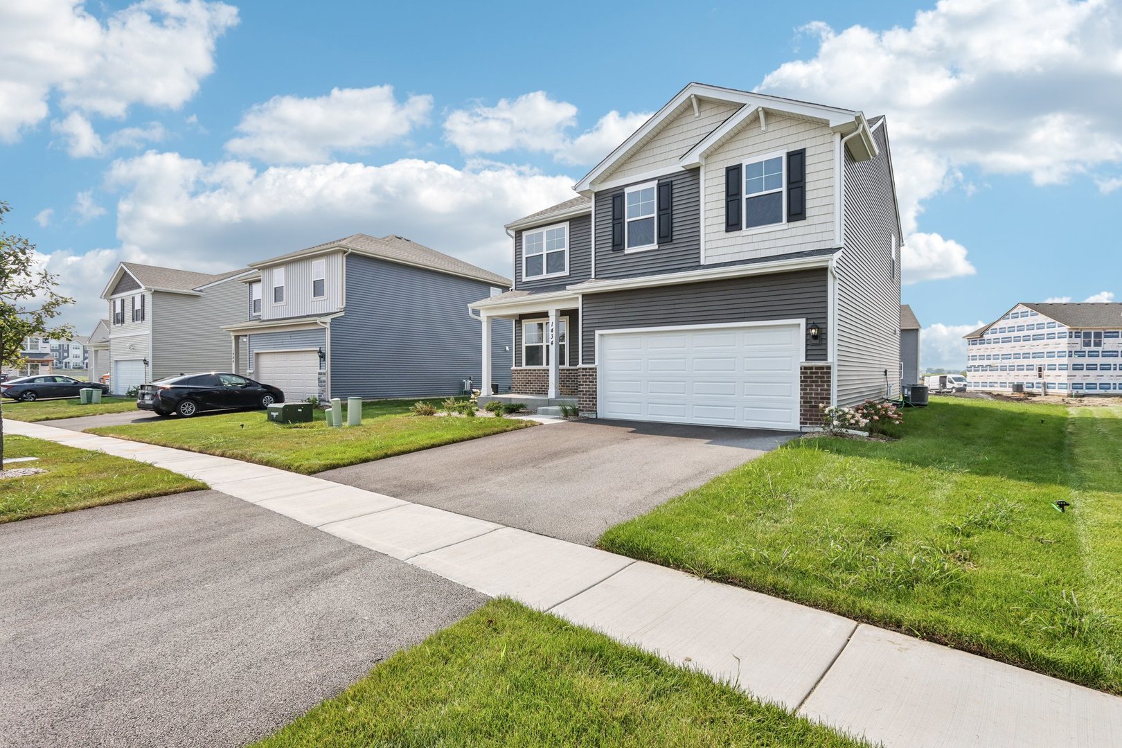 1552 Aspen Lane Pingree Grove, IL 60140 - Photo 42 of 73 a front view of a house with a yard and garage