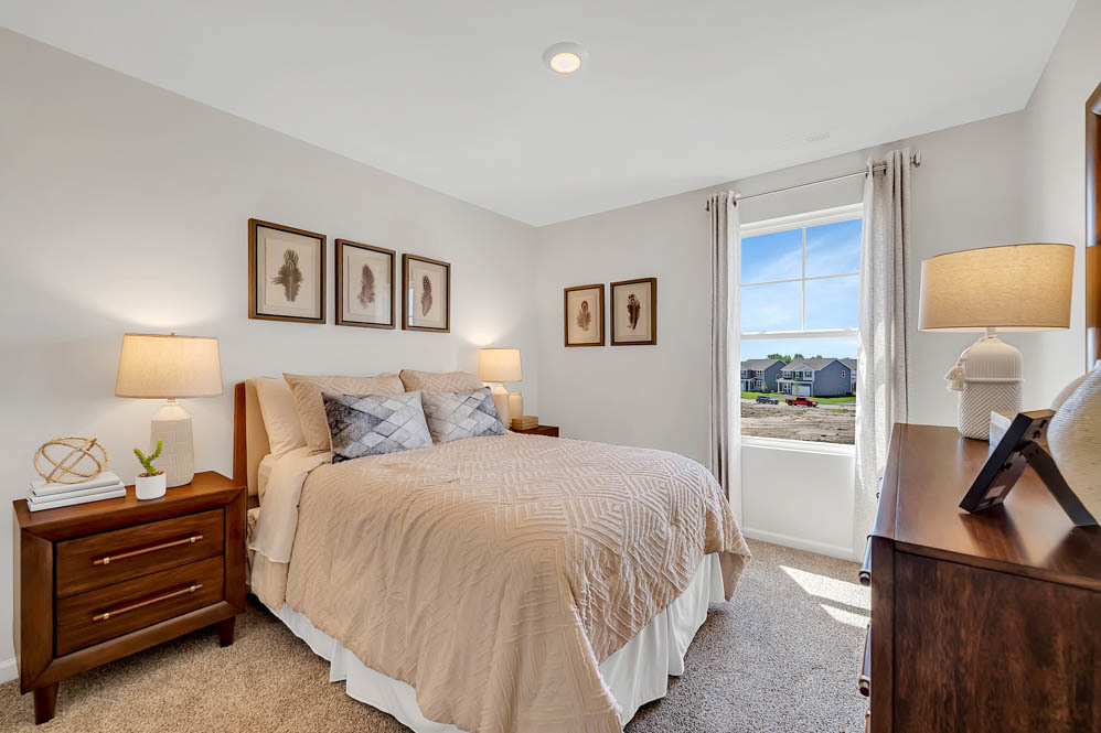 1552 Aspen Lane Pingree Grove, IL 60140 - Photo 57 of 73 a bedroom with a bed and a lamp on dresser