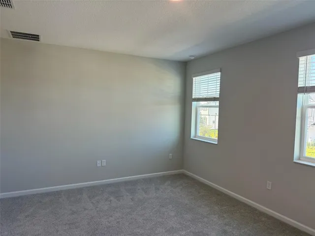 a bathroom with a double vanity sink and mirror