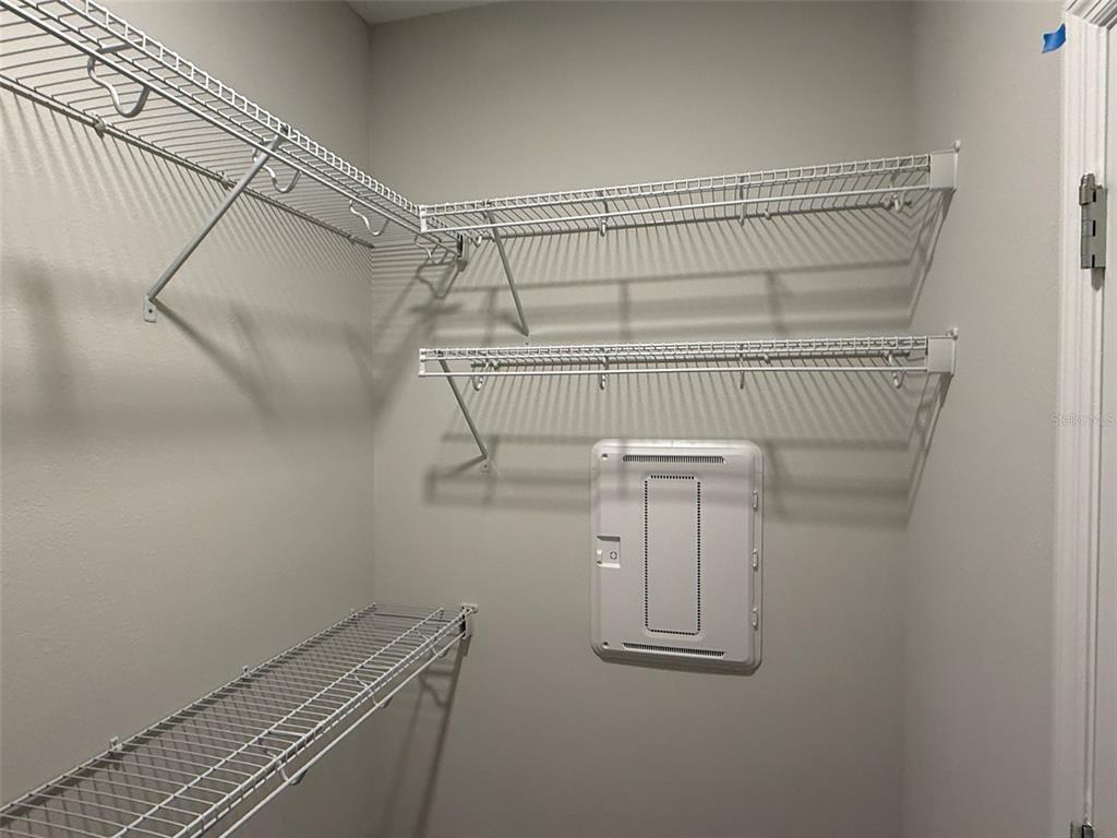 619 Pothos Street Apopka, FL 32703 - Photo 28 of 37 a view of a room with racks on the wall